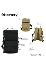 Mochila cilíndrica color beige/camel, con tres compartimentos apilados cerrados con cremallera negra. Presenta el logo "Discovery" bordado en la parte superior y el mismo texto repetido tres veces en la parte inferior. Incluye asa superior y correa ajustable para llevar al hombro.