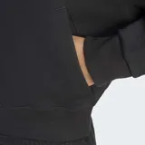 Campera Adidas Originals con capucha, corte cropped y holgado, de color negro, con cierre frontal completo y el logo del trébol bordado en el pecho.