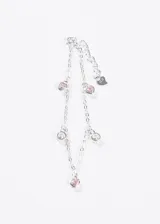 Pulsera de plata 925 hipoalergénica con cadena de eslabones finos y colgantes. Incluye corazones con piedras rosas y dijes redondos con piedras transparentes.