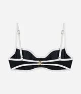 Top de bikini con aros color negro y detalles de bies en tono crudo, confeccionado en microfibra texturizada. Presenta tirantes finos ajustables y copas estructuradas que brindan soporte.