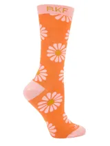 Medias de largo medio confeccionadas en fibra de bambú, color naranja con estampado de margaritas rosadas y detalles en rosado en talón, puntera y puño.