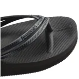 Sandalias tipo ojota Havaianas color negro, con diseño de plataforma y tiras finas con textura grabada.