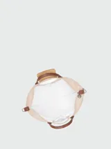 Bolso de viaje ampliable Longchamp de la línea Le Pliage Original, color marrón caqui con detalles en cuero marrón y herrajes metálicos plateados. Cuenta con asas de mano y correa de hombro ajustable y extraíble.