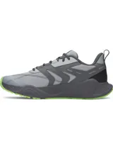Championes de entrenamiento Under Armour Charged Commit TR 5, color gris con detalles en verde neón. Presentan parte superior de malla transpirable con revestimientos de cuero, entresuela Charged Cushioning para absorción de impactos y suela de goma con refuerzos laterales.