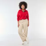Pantalón de punto de corte ancho y tiro alto, en color beige, con cintura elástica y diseño fluido.