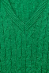 Jersey de punto con diseño de ochos, escote en pico y manga larga.