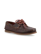 Mocasines tipo náutico color marrón oscuro, confeccionados en cuero, con cordones de cuero en contraste y suela de goma plana.