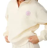 Buzo Rip Curl de felpa color blanco, con cuello alto y cierre corto de medio zip. Cuenta con manga larga y un pequeño estampado circular en lila en el pecho.