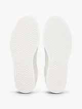 Zapatillas bajas de cuero y sintético en color blanco, con diseño de cordones, suela de goma y detalles de la marca Tommy Jeans.