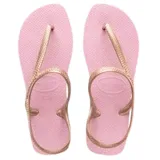 Sandalias tipo ojota Havaianas modelo Flash Urban, con base de goma color rosado y tiras finas metálicas en color oro rosa que rodean el talón.