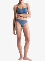 Colaless Calvin Klein de microfibra azul con bordes cortados a láser y logo estampado en la cadera.