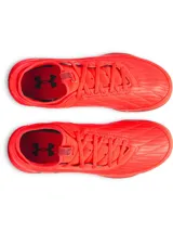 Championes de fútbol sala Under Armour Magnetico Select 4 Indoor, color rojo brillante con suela de goma marrón y logo de la marca estampado en el lateral con diseño multicolor.