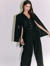 Pantalón de lino color naranja, de tiro alto y corte wide leg.