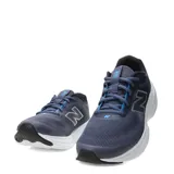Championes de running New Balance modelo 411, color azul marino con detalles en blanco y logo lateral plateado. Confeccionados en malla transpirable con suela de amortiguación blanca.