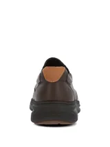 Zapatos slip on Hush Puppies modelo Hunt II, color marrón, confeccionados en cuero con elásticos laterales para un calce fácil y suela ultraliviana.
