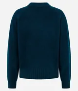 Suéter de tricot color blanco, con cuello redondo, mangas largas y terminaciones acanaladas en puños y ruedo.