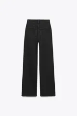 Jeans de tiro alto y estilo wide leg, con diseño de cinco bolsillos, lavado oscuro con efecto desgastado, pierna ancha larga y bajo sin costuras.