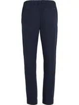 Pantalón de corte cónico Tommy Hilfiger, modelo 1985 Collection, color azul marino. Confeccionado en mezcla de algodón orgánico, con cintura elástica, cierre de botones y bolsillos traseros de ojal.