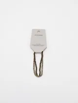Pack de dos pulseras compuestas por pequeñas cuentas facetadas en tonos negro, dorado y plateado.