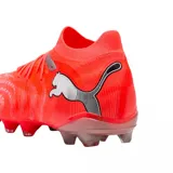Championes de fútbol Puma Future 9 Match FG/AG, color naranja vibrante con detalles en plateado. Diseño de corte medio con tecnología de ajuste avanzado y suela especializada para tracción en césped natural y artificial.