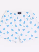 Bóxer de algodón blanco con estampado de flores pequeñas color celeste, con cintura elástica y logo de la marca en el centro.