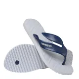 Sandalias tipo ojota Havaianas modelo Track, color negro con detalle de logo en color rojo en las tiras. Presentan una suela con diseño de relieve en zigzag y textura antideslizante.
