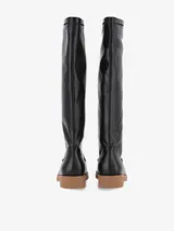 Botas altas de eco cuero negro con efecto arrugado en la caña, base de goma marrón claro de 3,5 cm y costura en la puntera.