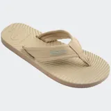 Ojotas Havaianas Surfer Coast de color negro, con tiras de tela texturizada y suela con diseño ondulado.