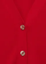 Cardigan de punto fino color rojo, con cuello en pico, cierre frontal con botones y manga larga con puños acanalados.