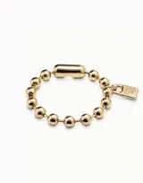 Pulsera unisex de bolitas bañadas en plata con conector y un candado de la firma UNOde50 a modo de charm.