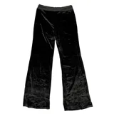 Pantalón de jogging de terciopelo negro con corte slim fit, cintura elástica con cordón ajustable y detalle de estrellas formadas por brillos aplicados en la pierna.