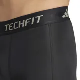 Calza corta de compresión Adidas Techfit negra con logo blanco en la pierna izquierda y cintura elástica con la inscripción Techfit en gris.