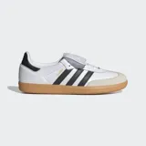 Championes Adidas Samba LT de diseño retro, confeccionados en cuero de primera calidad con puntera de nobuk. Presentan las icónicas tres bandas laterales en negro, suela de goma color caramelo y una lengüeta extragrande inspirada en las botas de fútbol clásicas.