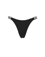 Panty tipo tanga negra con tiras laterales brillantes decoradas con pedrería y la inscripción de la marca Victoria's Secret.