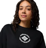 Remera de manga corta Columbia para mujer, de color negro y corte corto con ajuste moderno. Cuenta con cuello redondo con ribete acanalado y diseño gráfico circular con el logo de la marca en el centro del pecho.