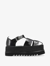 Sandalias negras de cuero con plataforma de yute y suela dentada.