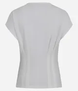 Blusa blanca de algodón con cuello redondo y mangas cortas. Presenta pliegues delanteros y traseros con efecto corsetado.