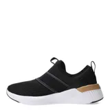 Championes Puma Softride Harli Slip On de mujer, color negro con detalles en dorado. Diseño slip-on con bandas elásticas cruzadas en el empeine y logo de la marca en dorado.