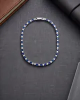 Pulsera de acero finamente engastada con circonias blancas y azules alternadas en toda su longitud.
