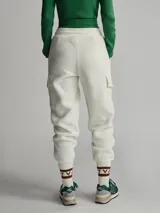 Pantalón jogger de mujer Varley, confeccionado en tela sherpa color crudo, con pretina elástica y bolsillos laterales.