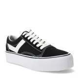 Championes de estilo urbano marca Pony, modelo Old School con plataforma. Presentan un diseño en color negro con detalles en blanco, incluyendo la característica franja lateral de la marca, cordones blancos y suela de goma blanca con textura en la puntera.