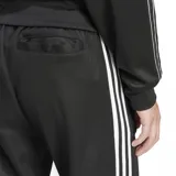 Pantalón deportivo Adidas Beckenbauer color negro con tres rayas blancas a los costados y logo bordado en blanco.