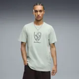 Remera Puma Scuderia Ferrari verde agua, de manga corta, con cuello redondo y estampado frontal del escudo de Ferrari en tono oscuro.