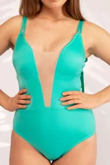 Malla entera color verde agua, confeccionada en lycra con microtul reforzado en la parte delantera.