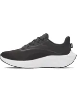 Championes de running Under Armour modelo W Ascend, diseñados específicamente para mujer. Presentan una parte superior de malla transpirable en color negro con refuerzos en el mediopié y el logo de la marca en el lateral. Cuentan con una entresuela blanca de amortiguación Charged+ Cushioning y suela de goma resistente.