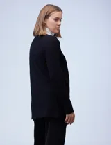 Cardigan abierto de tejido acanalado, con mangas largas y diseño de corte recto. Confeccionado por la marca Rio & Rian.