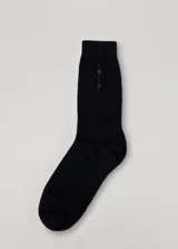 Medias de caña alta negras con diseño de strass plateados.