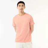 Camiseta recta de punto lisa color naranja salmón, de manga corta y cuello redondo.