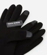 Guantes negros de poliéster y poliuretano, con detalle touch screen en uno de los dedos.
