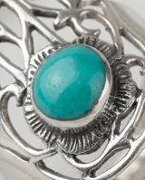 Anillo de plata 925 con diseño de mano de Fátima (Hamsa) calado y piedra turquesa central engastada.